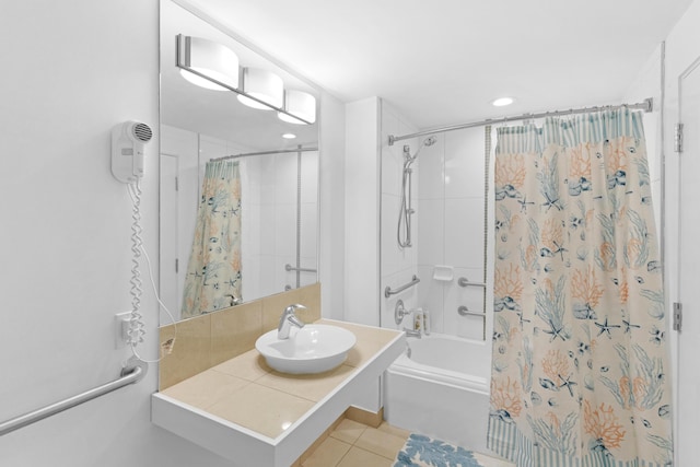 bathroom featuring tile patterned flooring, sink, and shower / bath combo