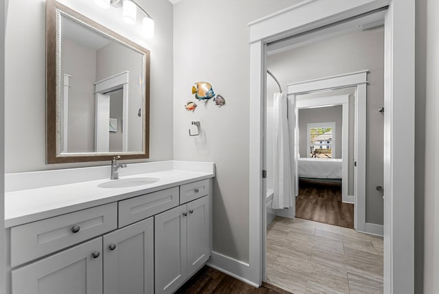 bathroom with vanity and shower / bath combo with shower curtain