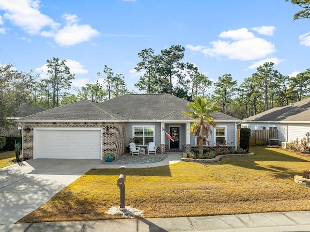 ranch-style home featuring a garage and a front yard