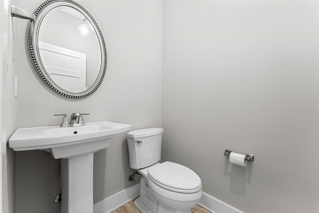 bathroom featuring toilet