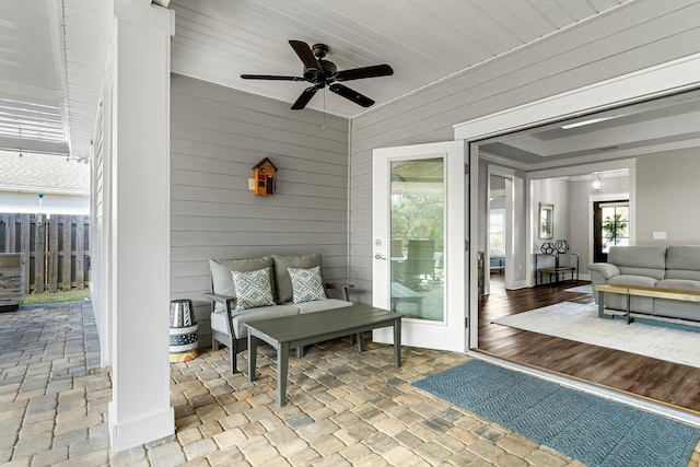 view of patio / terrace featuring ceiling fan and an outdoor living space