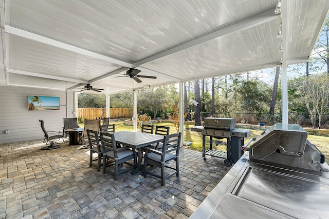 view of patio featuring area for grilling and ceiling fan