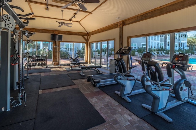 gym featuring ceiling fan and lofted ceiling