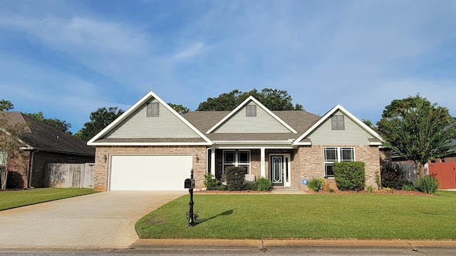 craftsman inspired home with a garage and a front yard