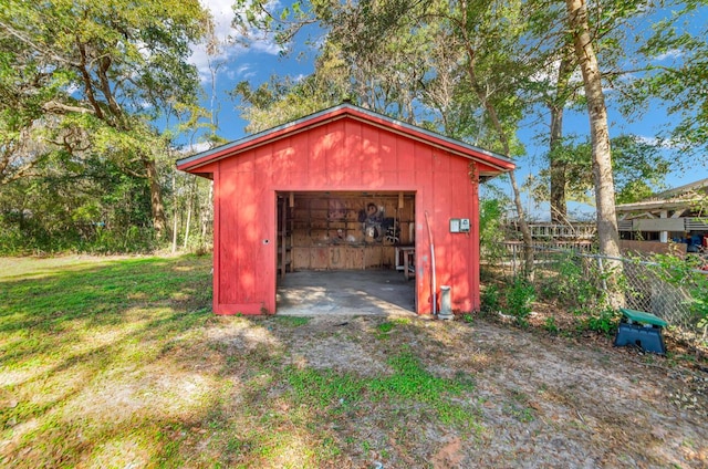 view of outbuilding with a yard