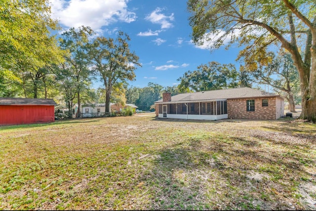 view of yard with a sunroom