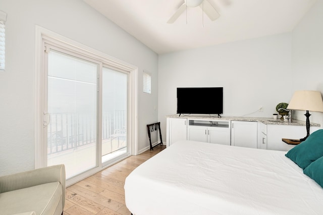 bedroom featuring access to exterior, ceiling fan, and light wood-style flooring