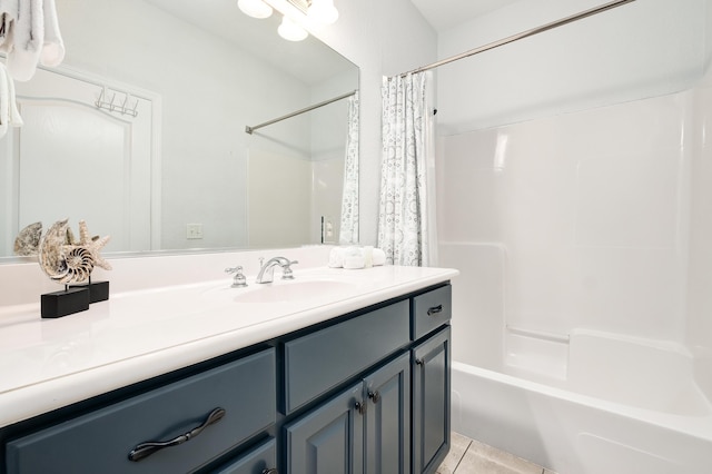 bathroom with shower / bath combination with curtain, vanity, and tile patterned floors