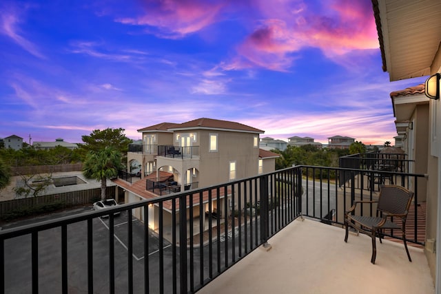 view of balcony at dusk