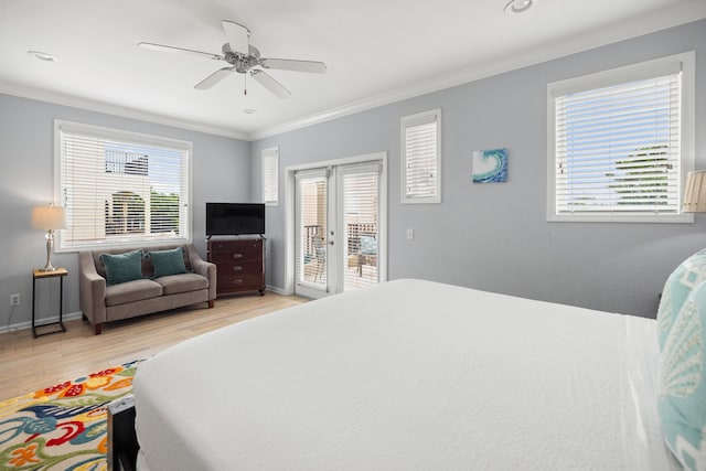 bedroom featuring access to exterior, baseboards, ornamental molding, and light wood finished floors