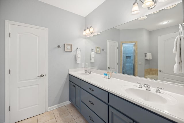 full bath featuring a garden tub, double vanity, a sink, and tile patterned floors