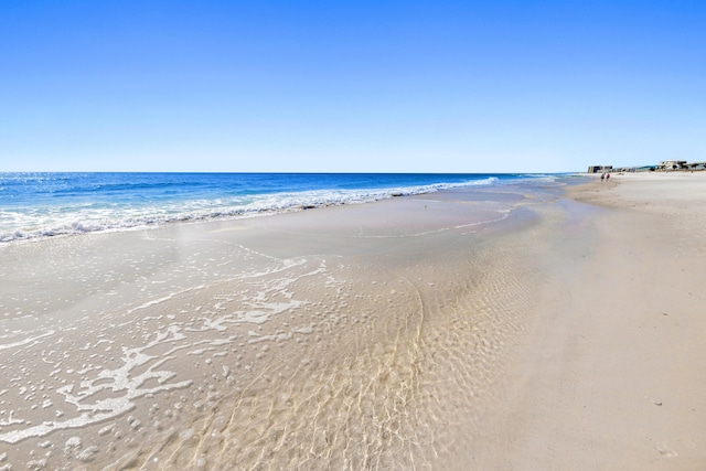 view of water feature with a beach view