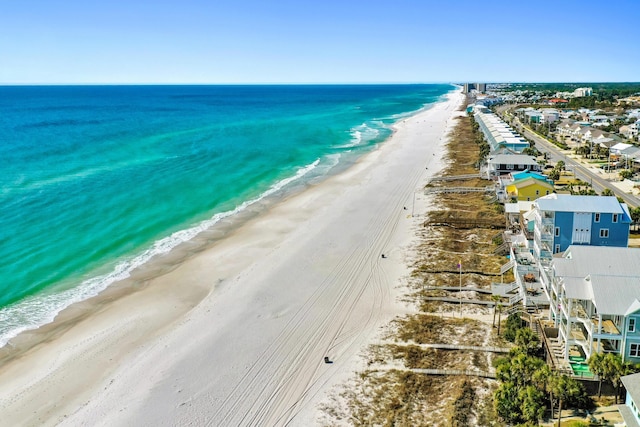 aerial view featuring a water view and a beach view