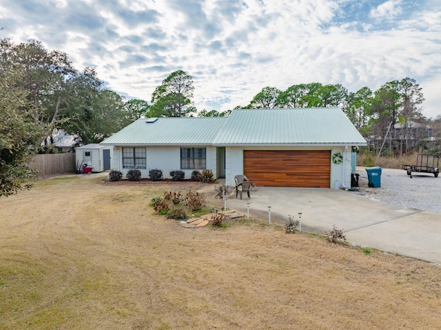 ranch-style house featuring a garage and a front lawn