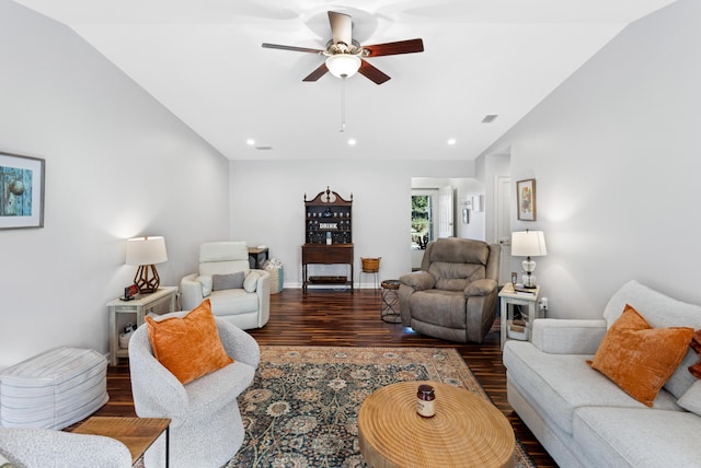 living room with dark hardwood / wood-style floors and ceiling fan