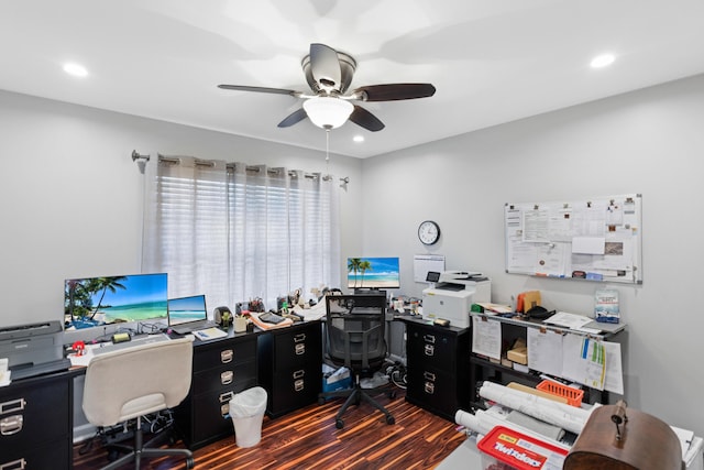 home office featuring dark hardwood / wood-style flooring and ceiling fan