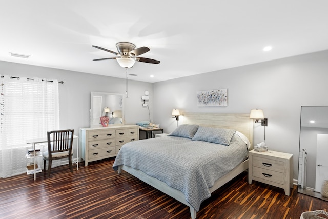 bedroom featuring dark wood-type flooring and ceiling fan