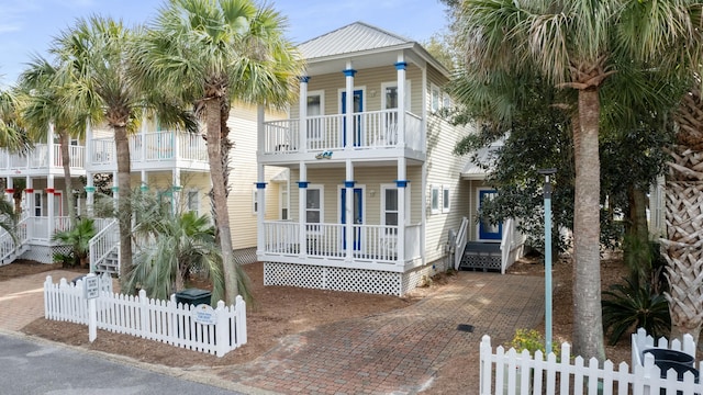 beach home featuring covered porch