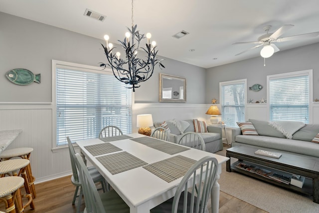 dining area with hardwood / wood-style floors, a wealth of natural light, and ceiling fan