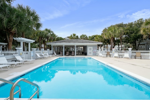 view of swimming pool with a patio area