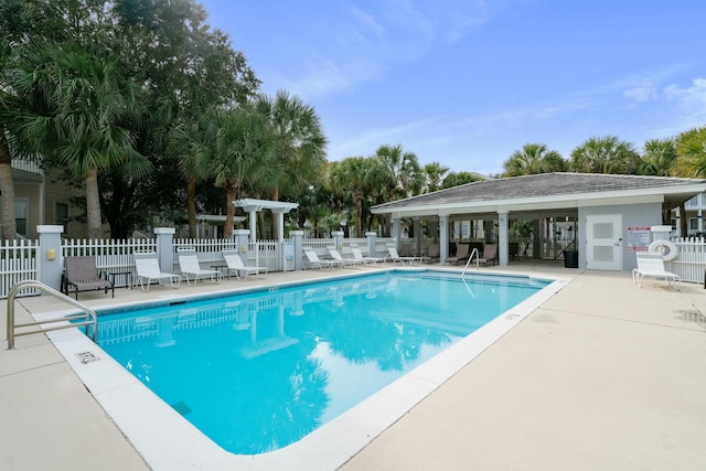 view of swimming pool with a pergola and a patio area