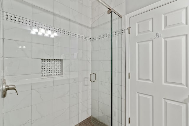 bathroom featuring an enclosed shower