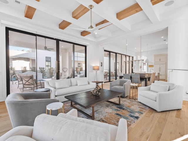 living room featuring ceiling fan, coffered ceiling, beam ceiling, and light hardwood / wood-style flooring