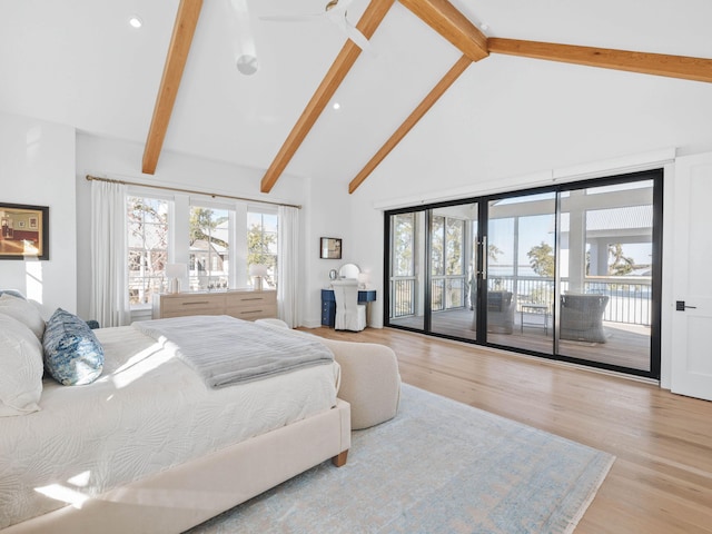 bedroom featuring access to exterior, beam ceiling, light hardwood / wood-style flooring, and high vaulted ceiling