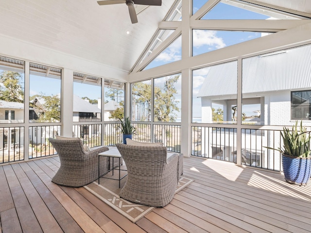 sunroom / solarium with lofted ceiling and ceiling fan