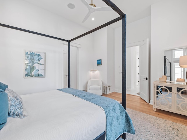 bedroom featuring hardwood / wood-style floors and ceiling fan