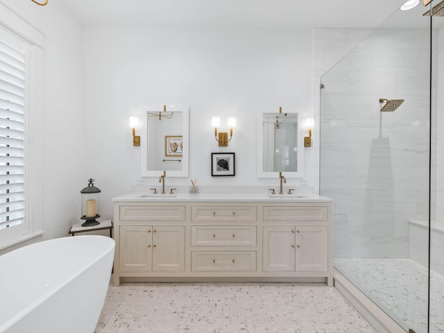 bathroom featuring shower with separate bathtub and vanity