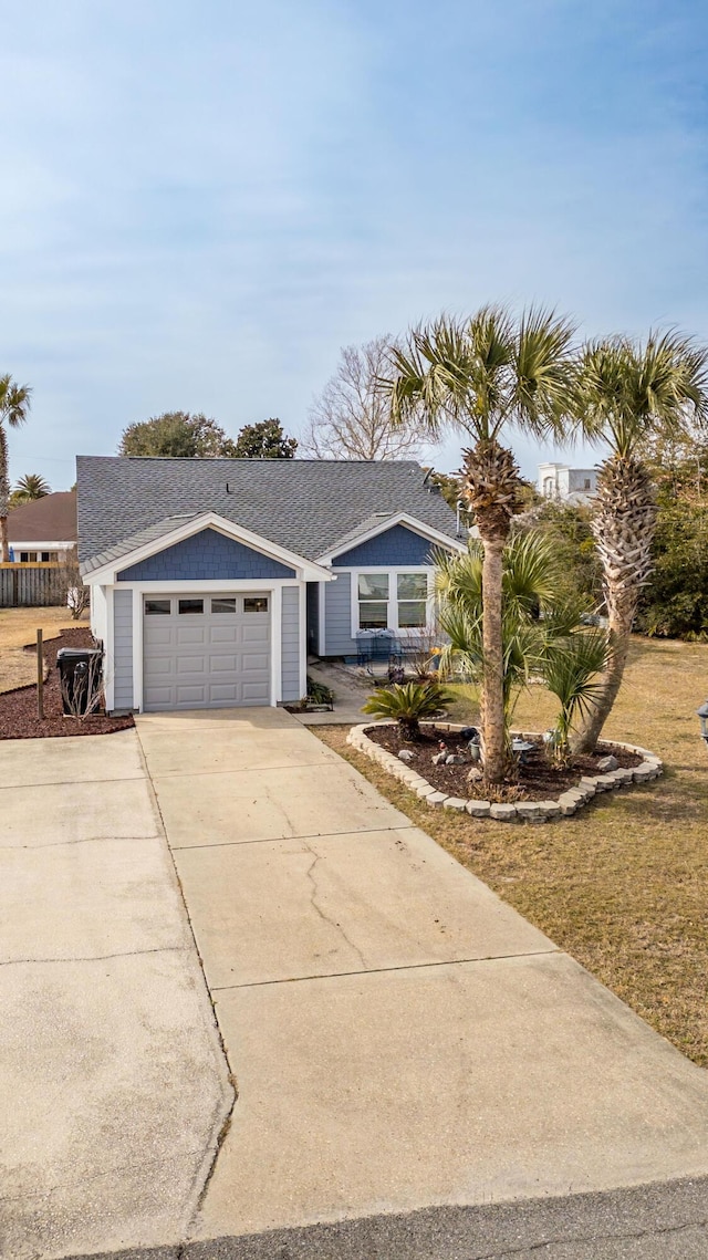 ranch-style home featuring a garage