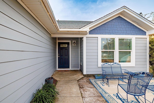 property entrance featuring a patio area