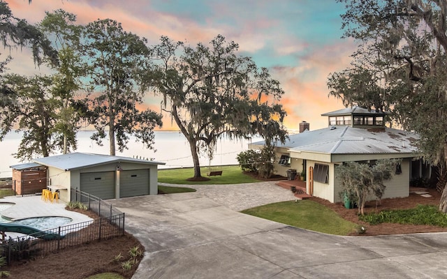 view of front facade with a garage and an outdoor structure