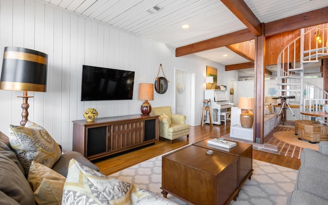 living room with beam ceiling and light wood-type flooring