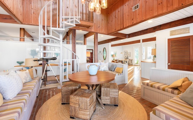 dining room with a notable chandelier and beam ceiling