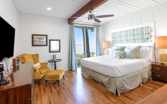 bedroom with ceiling fan, wood-type flooring, access to outside, wooden ceiling, and beamed ceiling