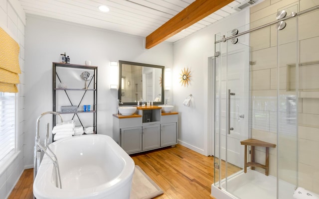 bathroom featuring plus walk in shower, hardwood / wood-style flooring, vanity, wood ceiling, and beam ceiling