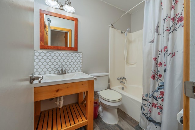 bathroom with shower / bath combination with curtain, toilet, and hardwood / wood-style flooring