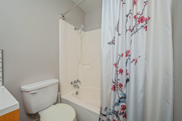 full bathroom with toilet, vanity, and shower / bath combo with shower curtain