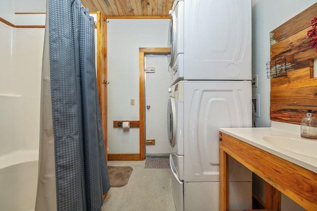 laundry area with stacked washer and clothes dryer