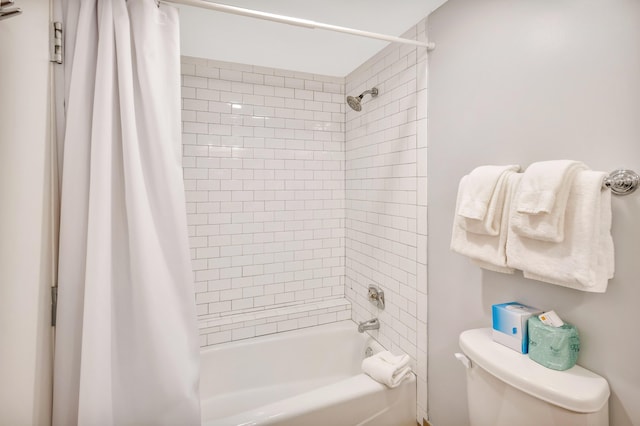 bathroom featuring shower / bathtub combination with curtain and toilet