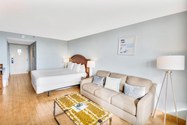 bedroom with light hardwood / wood-style flooring