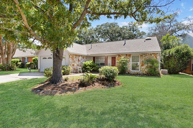 ranch-style house featuring a garage and a front yard