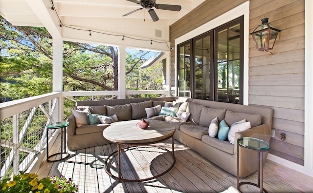 deck featuring outdoor lounge area and ceiling fan