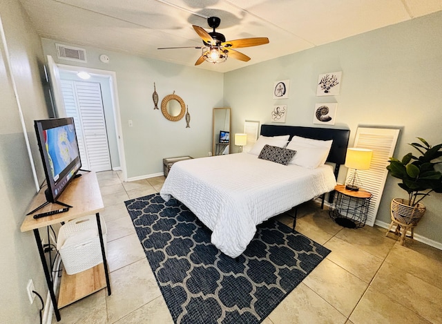 bedroom with light tile patterned floors and ceiling fan