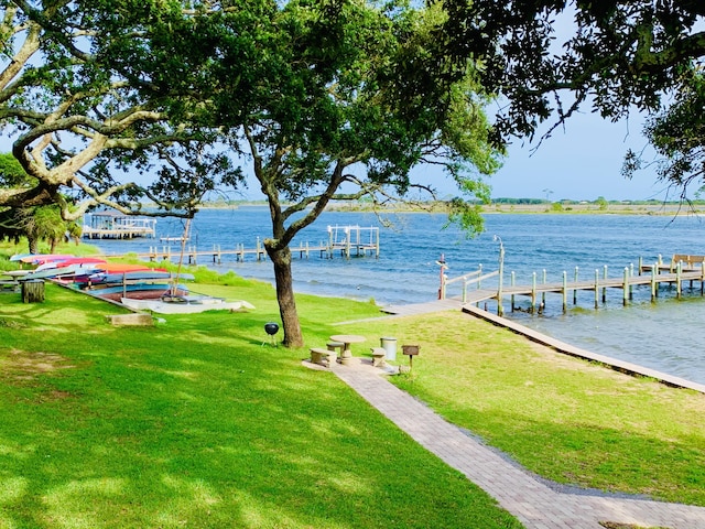 exterior space featuring a water view and a yard