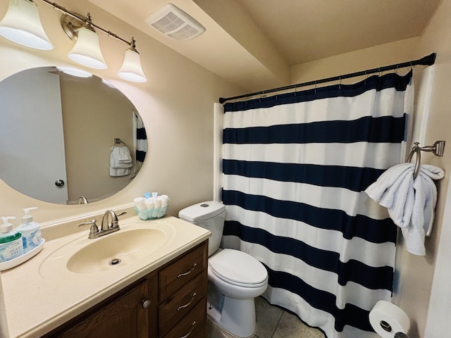 bathroom with tile patterned floors, toilet, a shower with shower curtain, and vanity