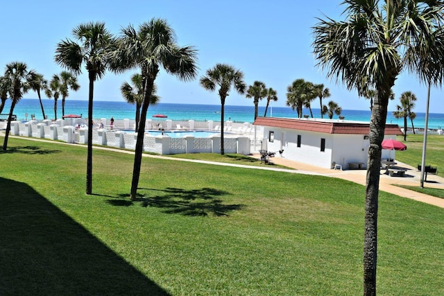 909 Santa Rosa Blvd Unit 329, Fort Walton Beach, FL 32548 - view of property's community featuring a pool, a yard, and a water view