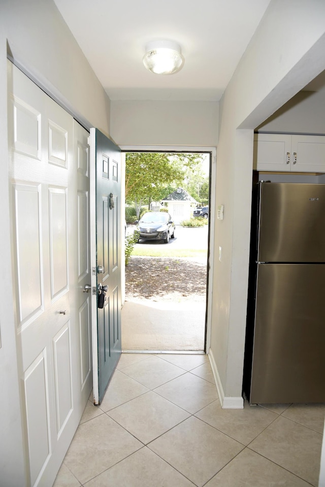 doorway featuring light tile patterned floors